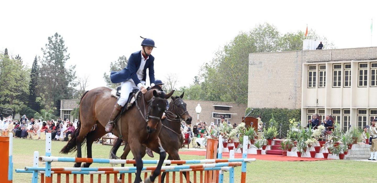 Horse rider cadet is jumping