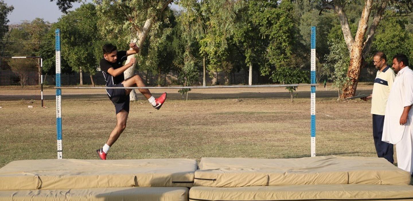 Cadet is making a high jump in sports competition