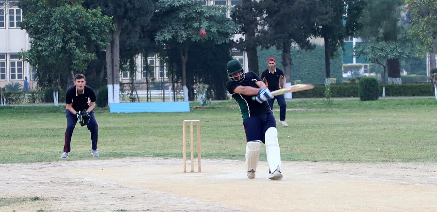 A cadet in action, while hitting a big six in a cricket match