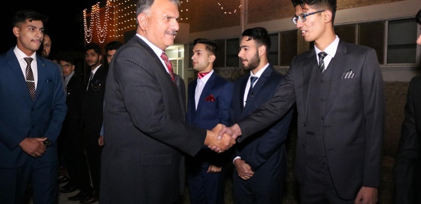 Principal is shaking hands with the cadets