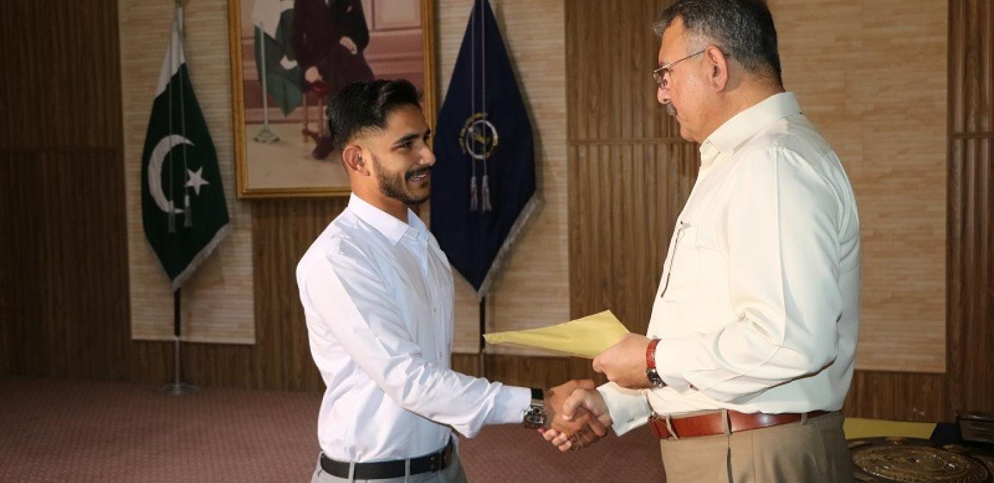 College Principal is awarding to a cadet