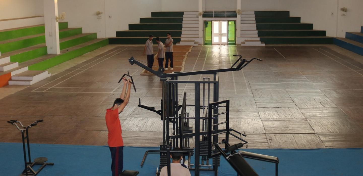 Cadet is doing exercise in the college Gymnasium
