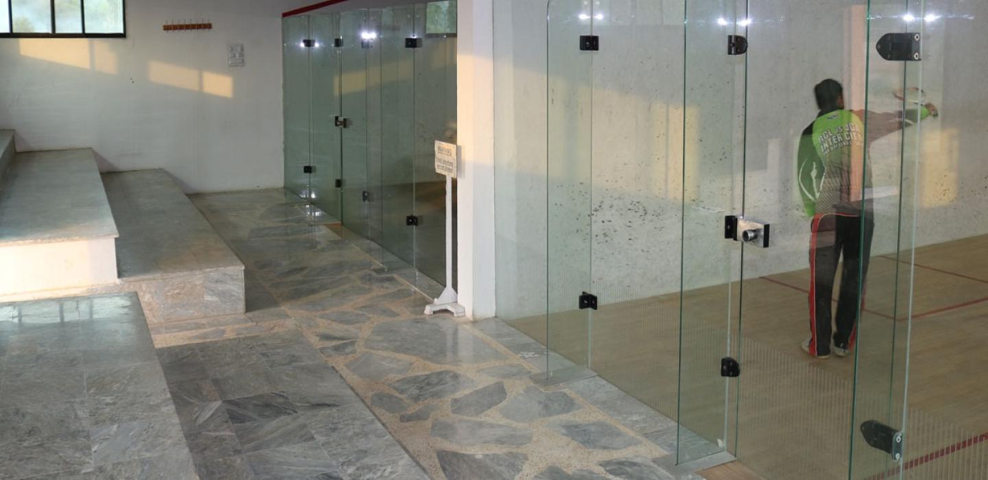 Players are playing in the squash court